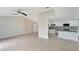 Modern kitchen with white cabinets, granite island and stainless steel appliances at 4501 Harrington St, Port Charlotte, FL 33948