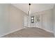 Bright dining room with modern light fixture and wood-look floors at 4501 Harrington St, Port Charlotte, FL 33948