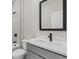 The bathroom includes a shower, toilet, and sink with a stylish black faucet at 5321 Crestline Ter, Port Charlotte, FL 33981