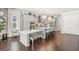 Open-concept kitchen with large island, breakfast bar, stainless appliances, and light gray cabinetry at 8414 Dunham Station Dr, Tampa, FL 33647