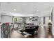 Spacious recreation room featuring a pool table, bar area, and comfortable seating for entertaining guests at 8414 Dunham Station Dr, Tampa, FL 33647