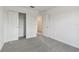 Bedroom with grey carpet and double door closet at 9809 Crescent Moon Dr, Riverview, FL 33578