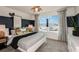 Stylish bedroom with a coastal theme and ample natural light at 9807 Crescent Moon Dr, Riverview, FL 33578