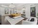 Luxurious main bedroom with dark hardwood floors and access to backyard at 8414 Dunham Station Dr, Tampa, FL 33647