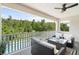 Balcony overlooking the pool and lush landscaping at 8414 Dunham Station Dr, Tampa, FL 33647