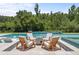 Inviting pool and spa with comfortable seating and tranquil setting at 8414 Dunham Station Dr, Tampa, FL 33647