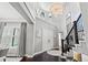 Elegant entryway with high ceilings, hardwood floors, and a large chandelier at 8414 Dunham Station Dr, Tampa, FL 33647