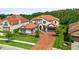 Luxury home with brick driveway and Spanish tile roof at 8414 Dunham Station Dr, Tampa, FL 33647