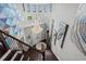 Grand staircase with geometric wall art and crystal chandelier at 8414 Dunham Station Dr, Tampa, FL 33647