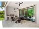 Outdoor kitchen with built-in grill and dining area at 8414 Dunham Station Dr, Tampa, FL 33647