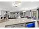 Wet bar with granite countertop and wine cooler at 8414 Dunham Station Dr, Tampa, FL 33647