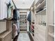 Modern walk-in closet with light wood shelving and drawers at 8414 Dunham Station Dr, Tampa, FL 33647