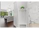 Clean bathroom with toilet and coat rack near kitchen at 8414 Dunham Station Dr, Tampa, FL 33647