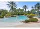 Community pool with water features and palm trees at 8414 Dunham Station Dr, Tampa, FL 33647