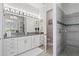 Elegant bathroom with double vanity, large shower, and soaking tub at 8414 Dunham Station Dr, Tampa, FL 33647