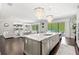 Elegant kitchen features a large island, stainless steel appliances, and pool view at 8414 Dunham Station Dr, Tampa, FL 33647
