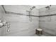 Spacious shower with dual shower heads and built-in seat at 8414 Dunham Station Dr, Tampa, FL 33647