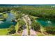 Community entrance with guardhouse and landscaping at 8414 Dunham Station Dr, Tampa, FL 33647