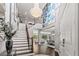 Bright and spacious entryway with hardwood floors and a stunning chandelier at 8414 Dunham Station Dr, Tampa, FL 33647