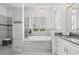 Modern bathroom with a large soaking tub and walk-in shower at 8414 Dunham Station Dr, Tampa, FL 33647