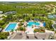 Aerial view of community pool and surrounding landscape at 8414 Dunham Station Dr, Tampa, FL 33647