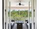 Private balcony with wooded views and outdoor seating at 8414 Dunham Station Dr, Tampa, FL 33647