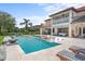 Relaxing pool area with comfortable lounge chairs and a fire pit at 8414 Dunham Station Dr, Tampa, FL 33647