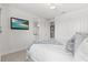 Comfortable bedroom with TV and ensuite bath at 8414 Dunham Station Dr, Tampa, FL 33647