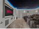 Home theater with reclining seats and a large screen at 8414 Dunham Station Dr, Tampa, FL 33647