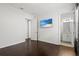Spacious bedroom with dark hardwood floors and en-suite bathroom at 8414 Dunham Station Dr, Tampa, FL 33647