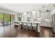 Modern kitchen with gray cabinets, stainless steel appliances, and access to backyard at 8414 Dunham Station Dr, Tampa, FL 33647
