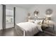 Comfortable bedroom with a queen-size bed and mirrored nightstands at 8414 Dunham Station Dr, Tampa, FL 33647
