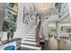 Elegant two-story foyer with hardwood floors and a grand staircase at 8414 Dunham Station Dr, Tampa, FL 33647