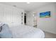 Bright bedroom with ensuite bathroom and TV at 8414 Dunham Station Dr, Tampa, FL 33647