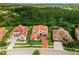 Luxury home on a tree-lined street with other upscale homes at 8414 Dunham Station Dr, Tampa, FL 33647