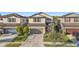 Two-story house with two-car garage and landscaped yard at 7779 Yale Harbor Dr, Wesley Chapel, FL 33545