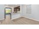 Modern kitchen with island, stainless steel appliances, and lake view at 7779 Yale Harbor Dr, Wesley Chapel, FL 33545