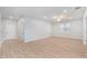 Light and airy entryway with wood-look floors at 7779 Yale Harbor Dr, Wesley Chapel, FL 33545