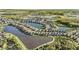 Wide aerial view of a lakefront community at 7779 Yale Harbor Dr, Wesley Chapel, FL 33545