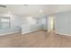 Bright loft with light walls and wood-look flooring, offering versatile space at 7779 Yale Harbor Dr, Wesley Chapel, FL 33545