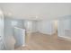 Spacious loft area with light walls and wood-look flooring at 7779 Yale Harbor Dr, Wesley Chapel, FL 33545