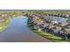 Aerial view of lakefront homes and neighborhood at 7779 Yale Harbor Dr, Wesley Chapel, FL 33545