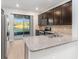 Modern kitchen with granite counters and stainless steel appliances at 7779 Yale Harbor Dr, Wesley Chapel, FL 33545