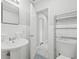 Bathroom with pedestal sink, toilet, and access to another room at 3315 58Th S Ave # 309, St Petersburg, FL 33712