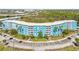 Aerial view of a large, curved apartment building with ample parking at 3315 58Th S Ave # 309, St Petersburg, FL 33712
