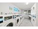 Shared laundry facility with several coin-operated washers and dryers at 3315 58Th S Ave # 309, St Petersburg, FL 33712