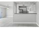 Modern kitchen with white cabinets and a breakfast bar at 3315 58Th S Ave # 309, St Petersburg, FL 33712