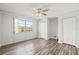 Spacious bedroom with ceiling fan, large windows, and ample closet space at 3315 58Th S Ave # 309, St Petersburg, FL 33712