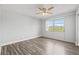 Bright bedroom with ceiling fan and large windows offering natural light at 3315 58Th S Ave # 309, St Petersburg, FL 33712