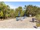 Community patio with tables, chairs, and umbrellas; perfect for outdoor relaxation at 3315 58Th S Ave # 309, St Petersburg, FL 33712